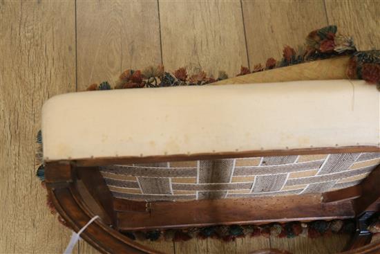 A Victorian rosewood X shaped stool, with old tapestry upholstered top, W.52cm